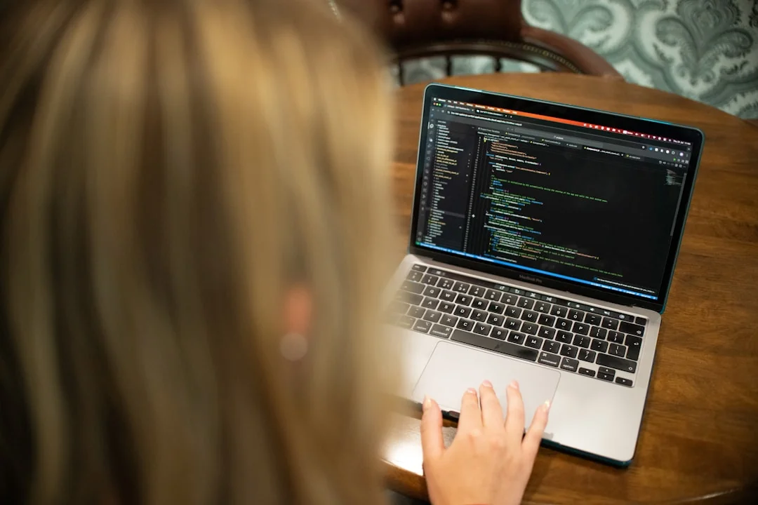 A stylish workspace featuring a laptop and monitors displaying design software.